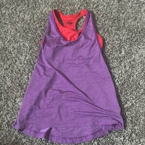 Nike tank top with attached sports bra. No padding. Size small
